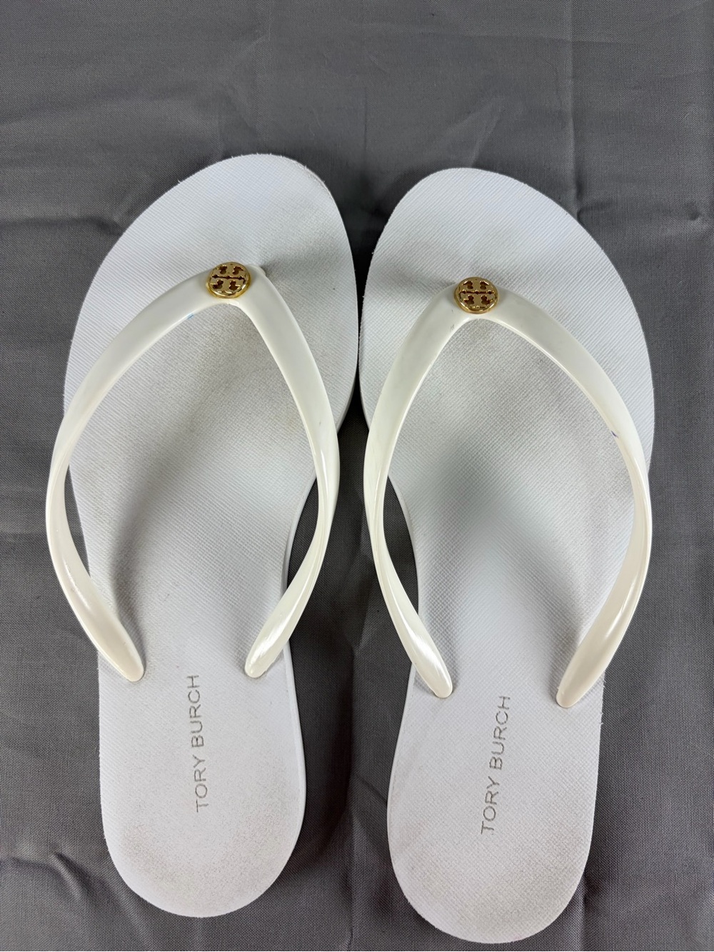 Tory Burch Cream Flip Flop Sandals with Gold Logo Medallions